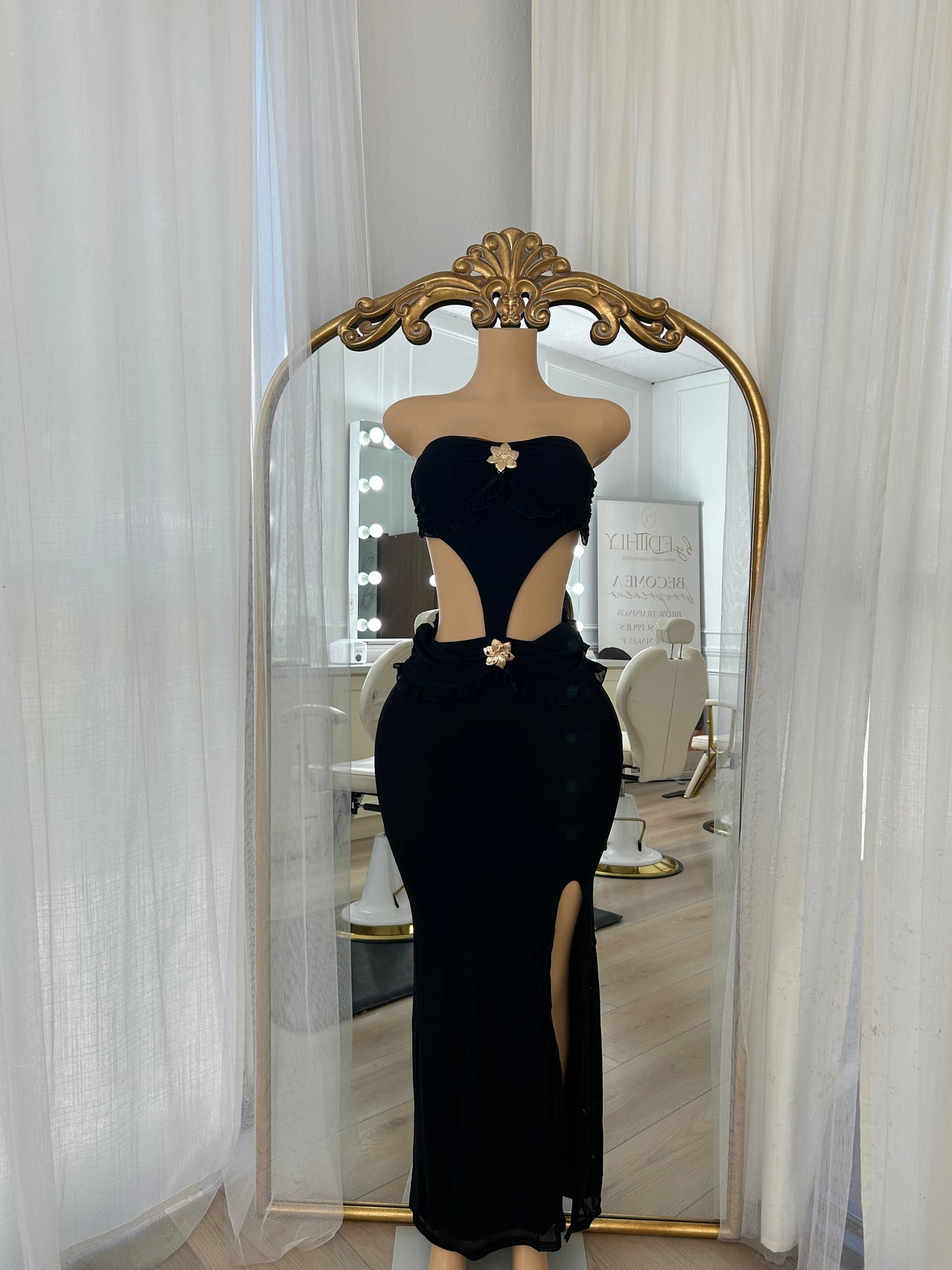 Black maxi dress with slit and gold flower detailing