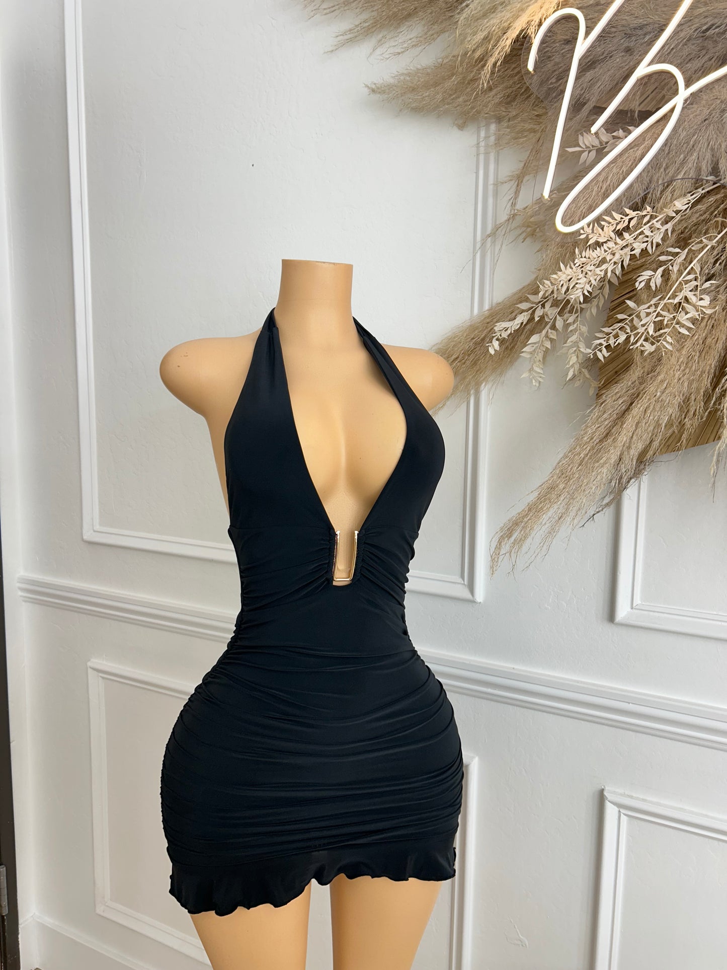 Black halter dress with gold piece